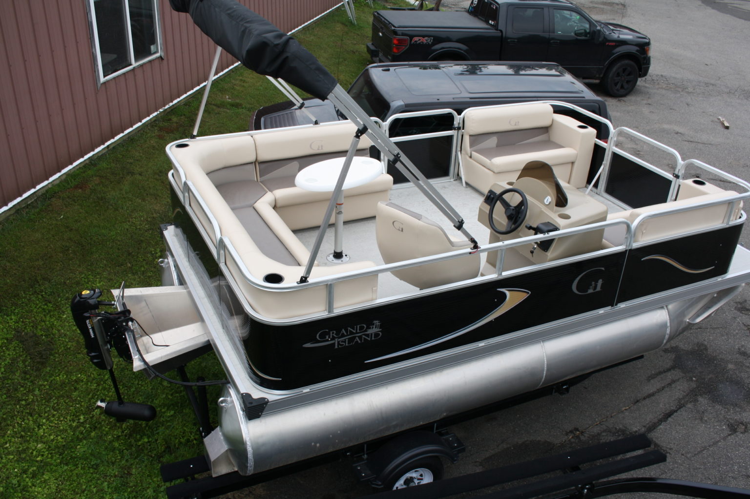 Electric 16 ft pontoon boat-Edrive and trailer. In stock and ready to